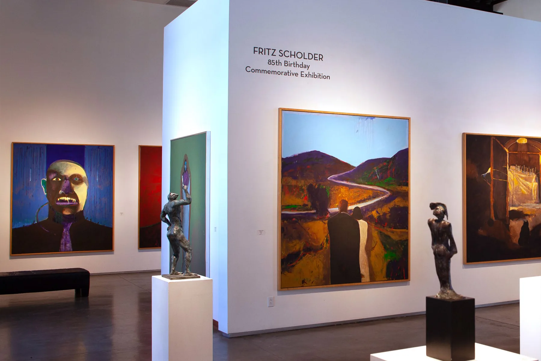 gallery with paintings on wall